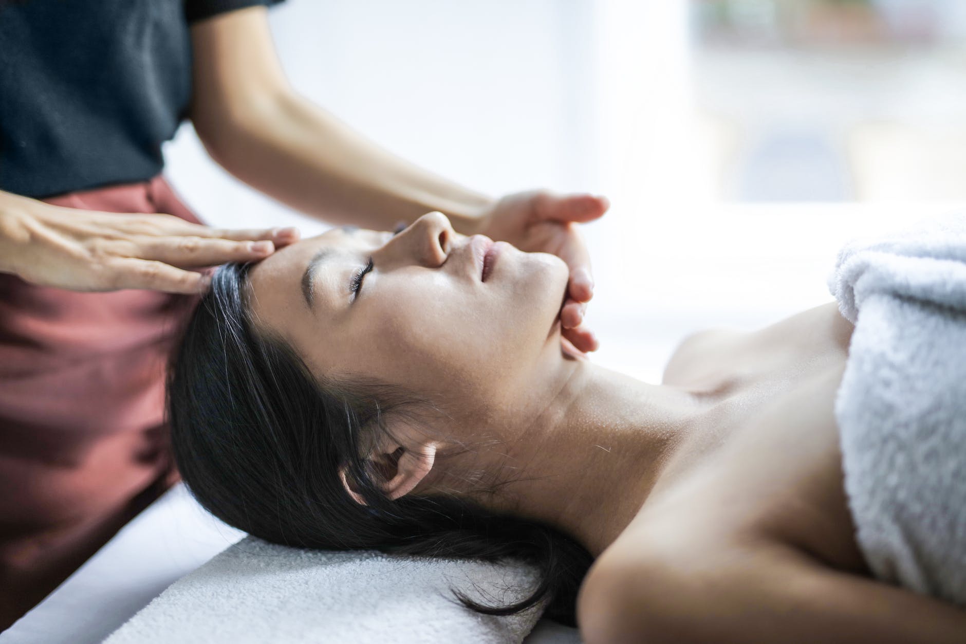 selective focus photo of woman getting a head massage
Pexels.com
