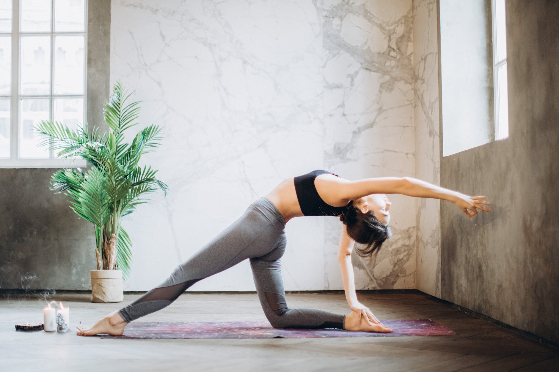 woman in gray leggings and black sports bra doing yoga on yoga mat
Photo by Elina Fairytale on Pexels.com